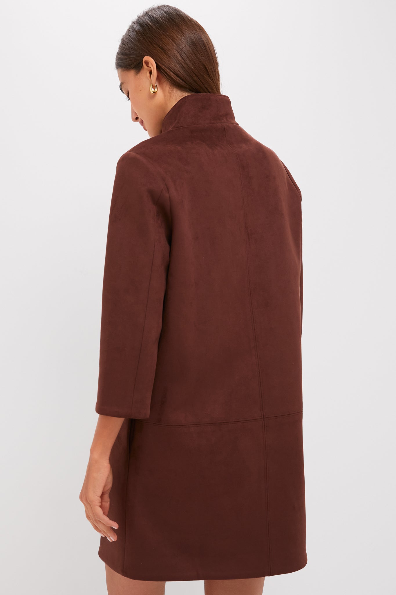 Model in the classic Ganache Vegan Suede Clifton Dress, showcasing a high-end, effortless style with its high collar, three-quarter sleeves, and luxurious suede texture.