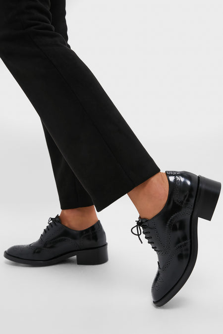 Black Leather Brogue Oxford Shoes with classic perforations and a block heel, embodying an effortless, high-end style, perfect for adding fun sophistication to any outfit.