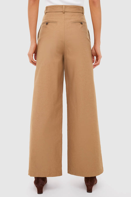 Back view of Umber Slubby Cotton Atelier Pleated Pant 2, showcasing classic wide-leg design with belt loops and welt pockets. Effortless, high-end style for versatile, fun occasions.