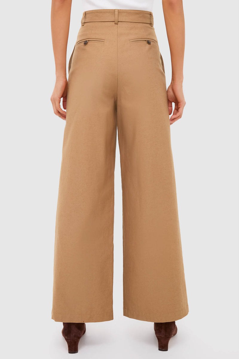 Back view of Umber Slubby Cotton Atelier Pleated Pant 2, showcasing classic wide-leg design with belt loops and welt pockets. Effortless, high-end style for versatile, fun occasions.
