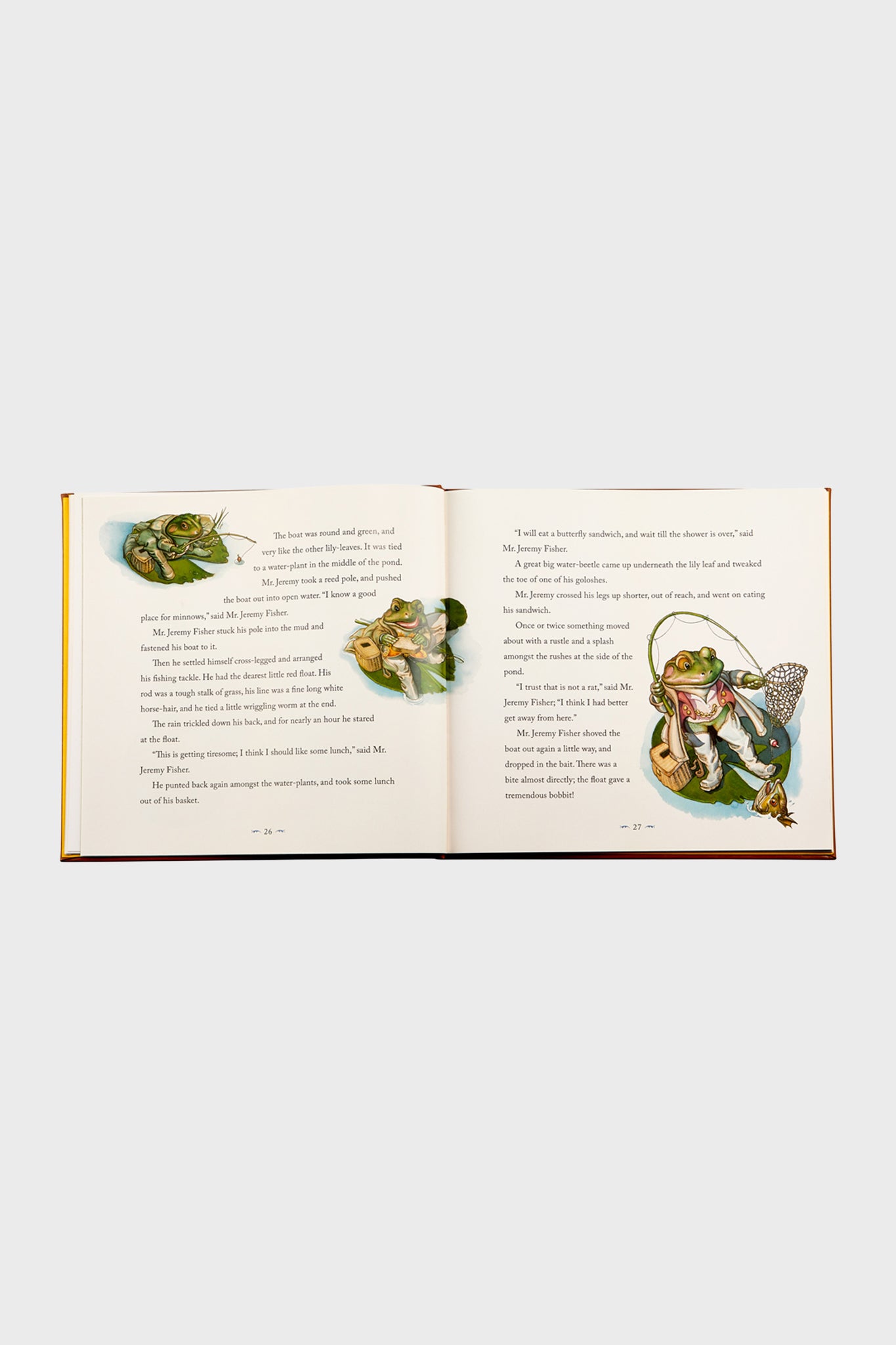 Children's picture book open to Mr. Jeremy Fisher's fishing tale, showcasing classic, effortless, and fun watercolor illustrations, embodying the high-end charm of The Classic Tale of Peter Rabbit.