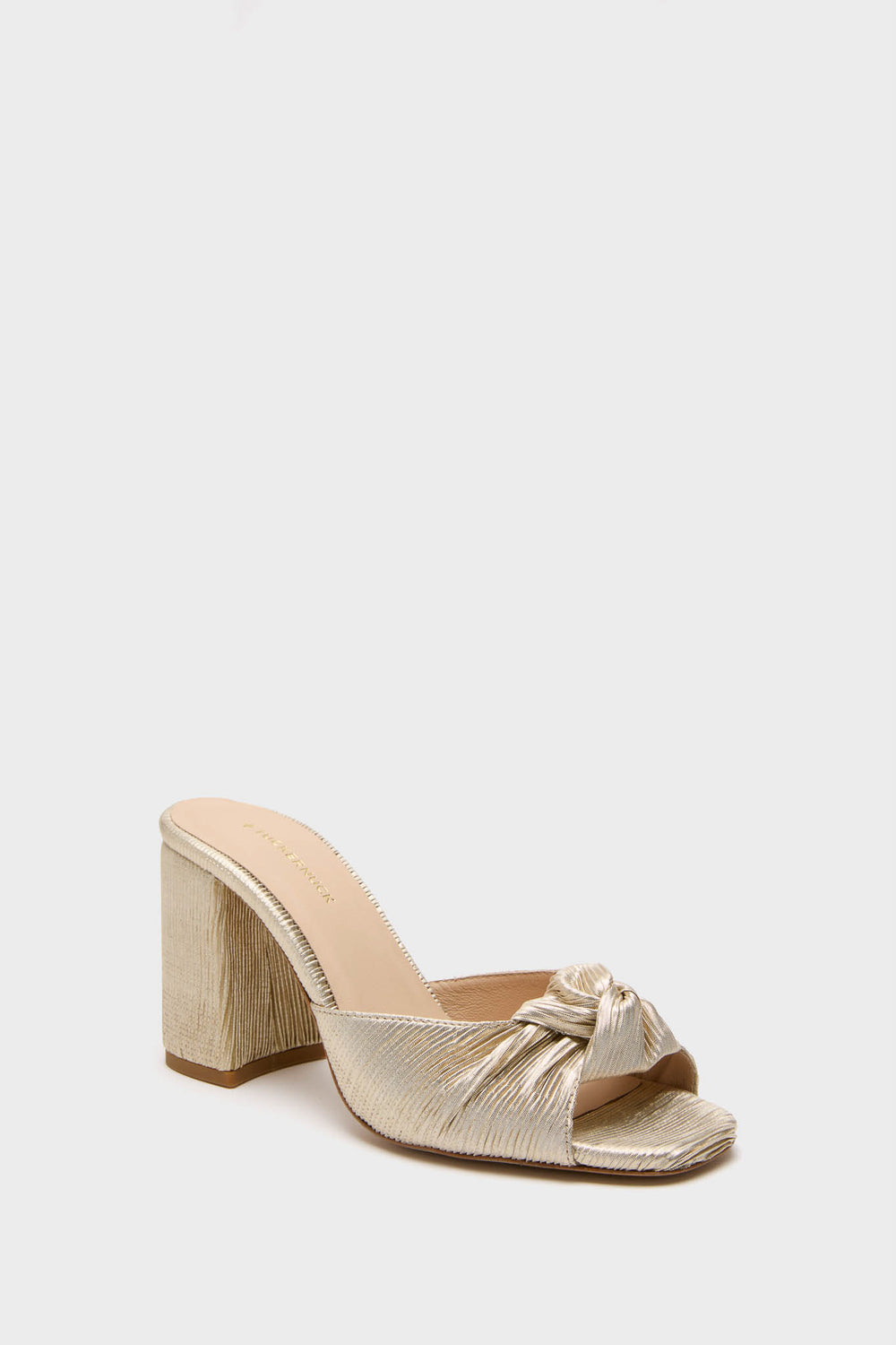 Gold Pleated Blake Heels: Classic mule-style shoe with a shimmery finish, featuring an effortless square toe, knotted pleated vamp, and a fun, high-end chunky block heel.