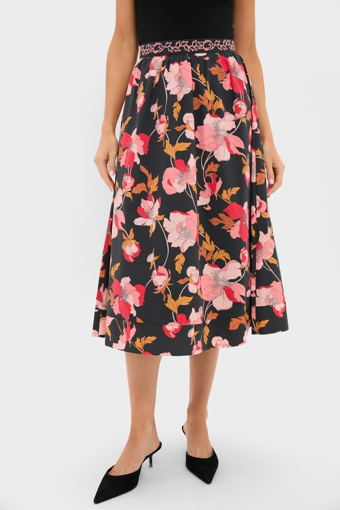Black & Shades of Pink Floral Embroidered Sia Maxi Skirt features a classic A-line silhouette and low-heel mules, embodying effortless, high-end style with fun, feminine flair.