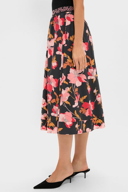 Black & Shades of Pink Floral Embroidered Sia Maxi Skirt with a classic A-line silhouette, paired effortlessly with black mule heels, showcasing an elegant, high-end, and fun style.