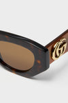 Shiny Dark Havana Cat-Eye Gucci Generation Sunglasses, showcasing classic tortoiseshell frames, brown-tinted lenses, and an effortless gold GG logo for a high-end, fun look.