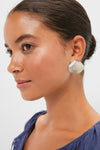 Young woman wearing a classic, high-end Antique Silver Clam Shell Earring, showcasing effortless elegance and fun sophistication, ideal for a confident and stylish look.