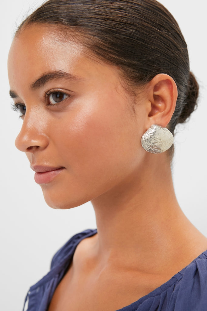 Young woman wearing a classic, high-end Antique Silver Clam Shell Earring, showcasing effortless elegance and fun sophistication, ideal for a confident and stylish look.