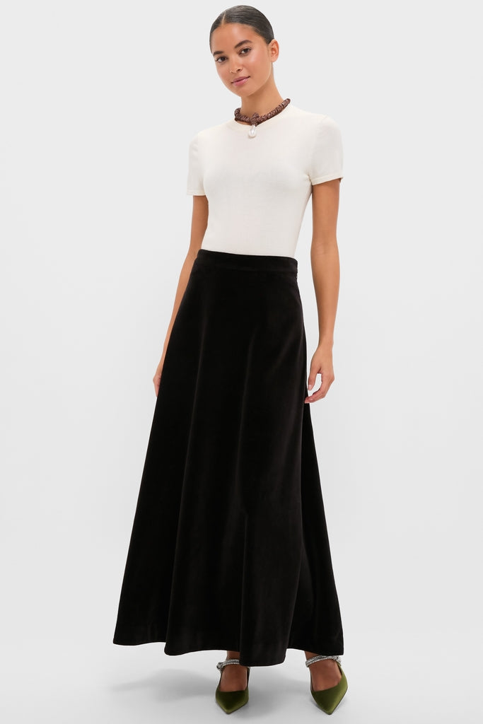 Model wears the Black Velvet Whitley Skirt, showcasing its classic high-low hem and effortless A-line silhouette, paired with a fun, high-end removable bow belt.