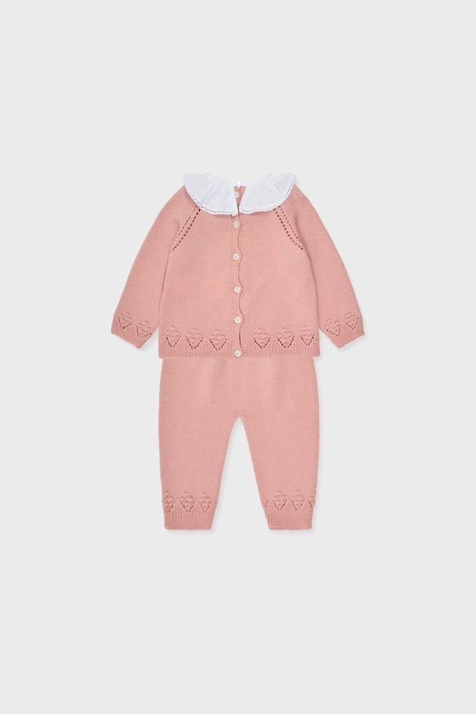 Dusty Pink Baya Merino Baby Girl Knitted Set: Effortlessly classic, this high-end two-piece features a ruffled collar cardigan and matching pants with heart details for fun, timeless charm.