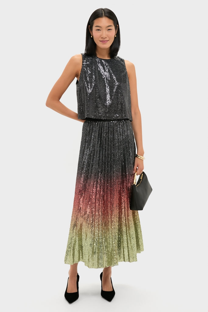 Young woman modeling the classic Ombre Sequin Bleeker Maxi Skirt with an effortless high-end look, featuring a fun, pleated sequin design and a matching top.