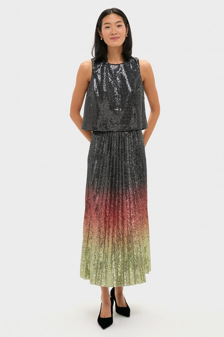 Woman in a classic, high-end Charcoal Sequin Bowery Top with a sleeveless high-neck bodice and an effortless ombré sequin skirt, embodying fun sophistication.