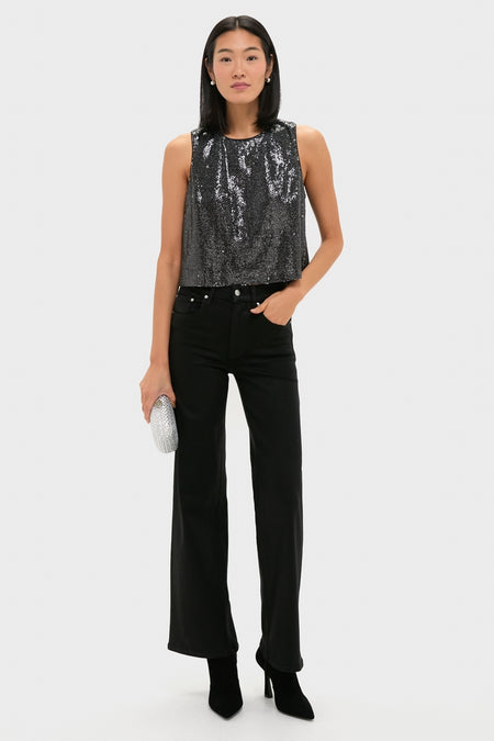 Model wearing Charcoal Sequin Bowery Top, a classic, effortless, high-end sleeveless piece, paired with black pants and a fun rhinestone clutch for a confident look.
