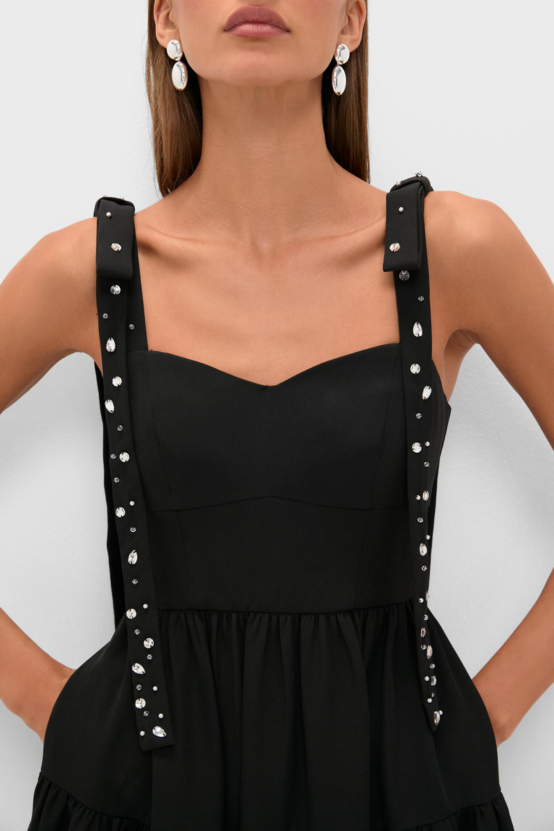 Black Embellished Agnes Maxi Dress with sweetheart neckline, crystal-studded straps, and corset waist. Effortlessly classic with side pockets and elegant silver earrings.