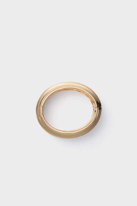 High Polish Gold Mega Lennon Bangle, a classic and high-end accessory with an effortless, smooth finish, perfect for adding a touch of fun sophistication.