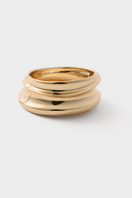 High Polish Gold Mega Lennon Bangle: A classic, high-end bracelet featuring three tubular loops, effortlessly hinged together for a fun, polished look.