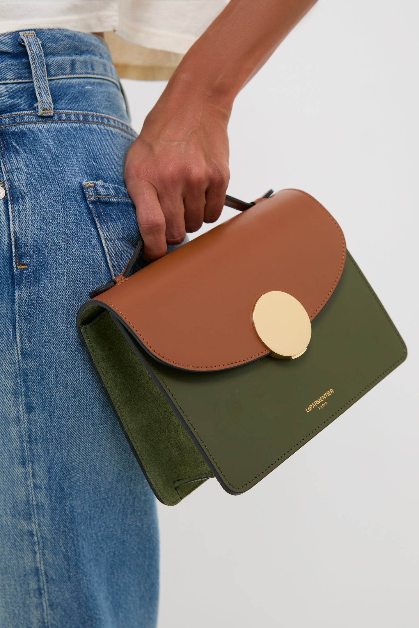 Caramel and Military Green Ondina Medium Color-Block Bag with gold clasp, leather handle, and suede lining, held effortlessly with fun, classic style. Perfect for high-end versatility.