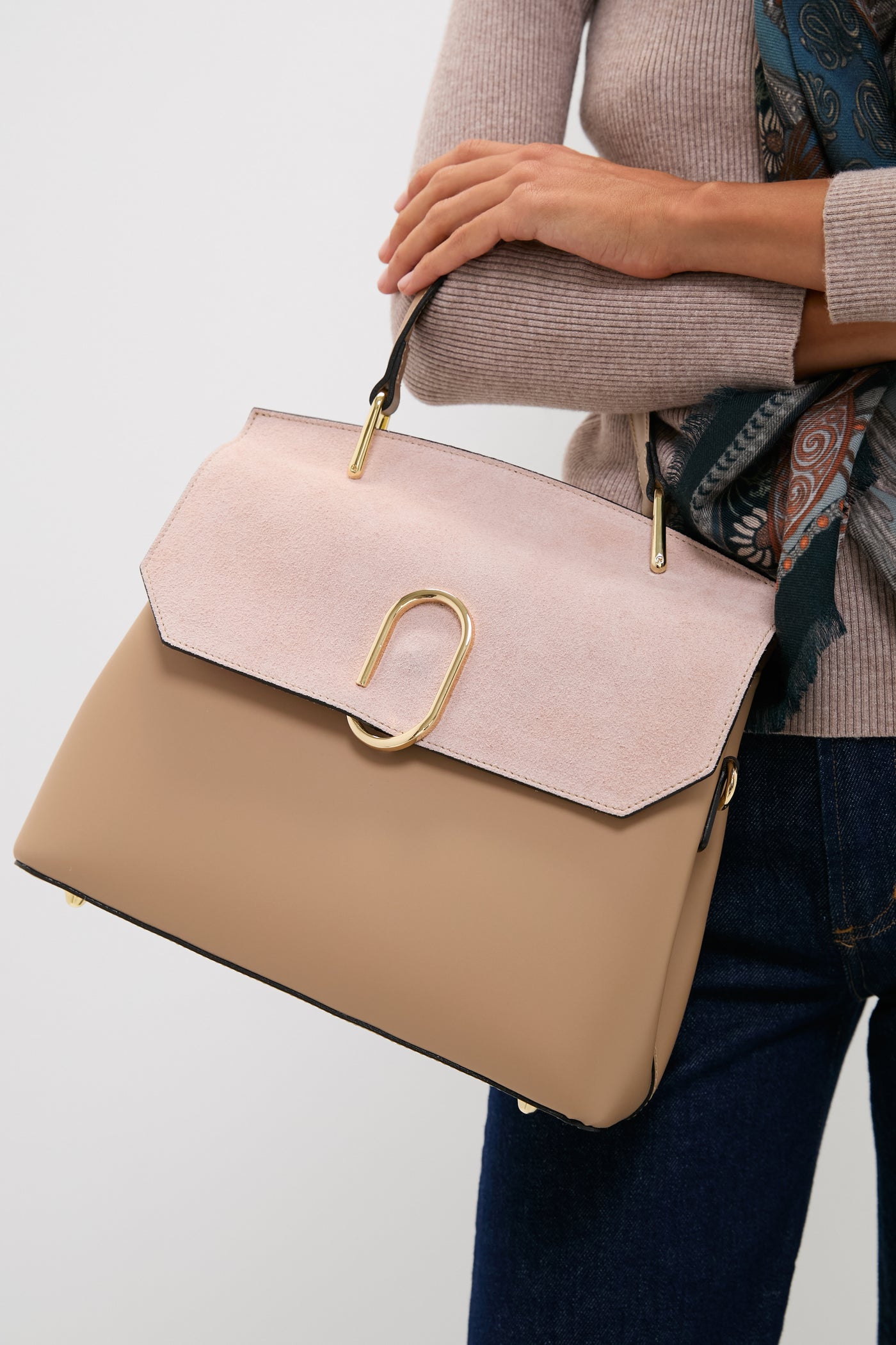 Nude Thais Satchel Bag with a classic, high-end design featuring tan leather and blush suede, gold hardware, and versatile compartments for an effortless, fun style.