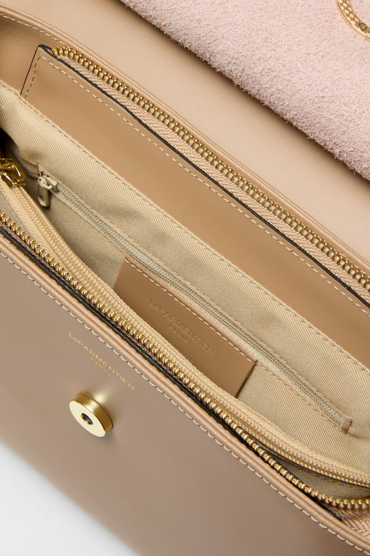 Nude Thais Satchel Bag, a classic, high-end accessory featuring a suede flap, gold-tone hardware, and organized compartments. Effortless luxury for a fun, confident style.
