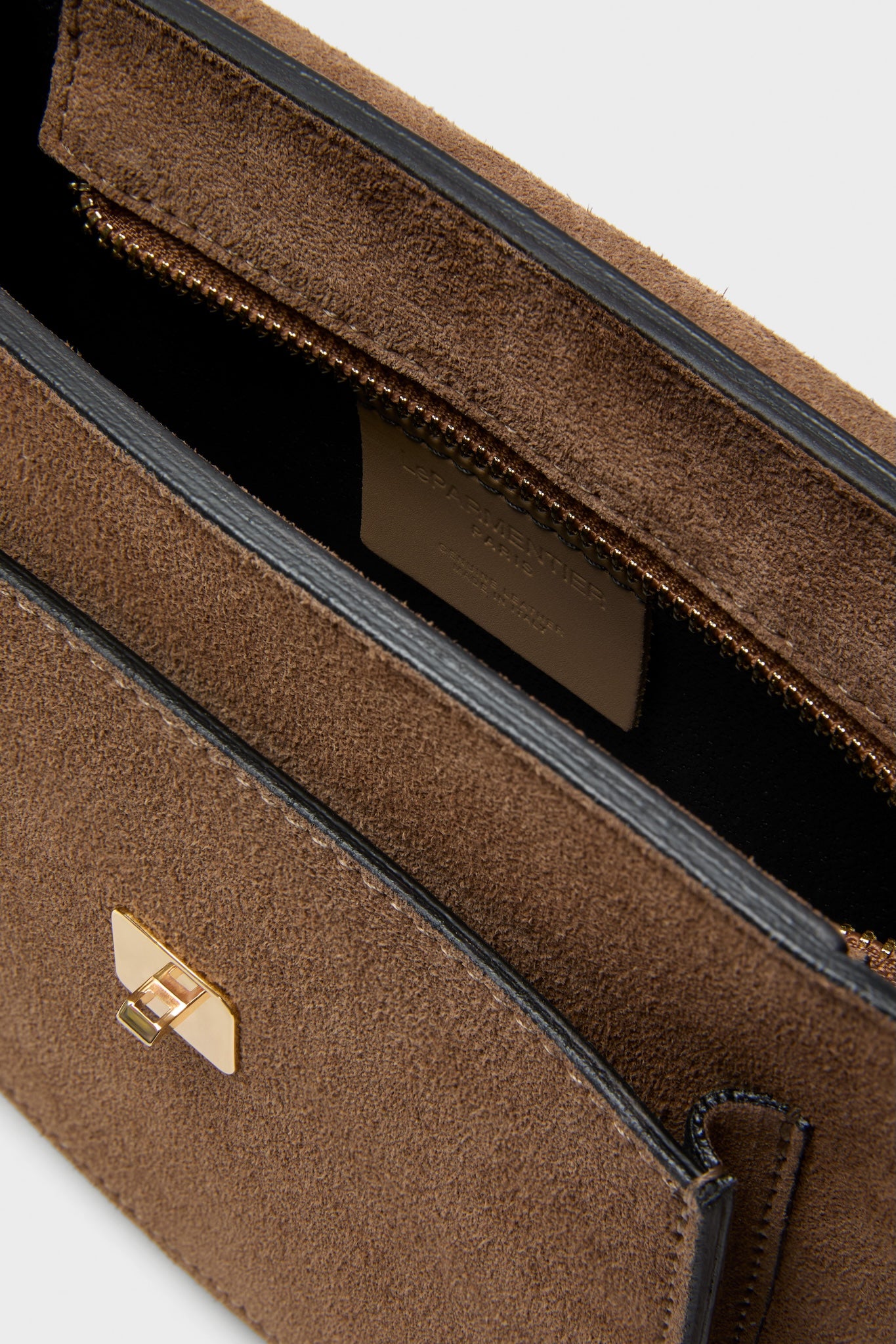 Taupe Agave Shoulder Bag: A classic, high-end suede handbag with gold-tone hardware and an effortless design featuring a push-lock clasp and adjustable strap.