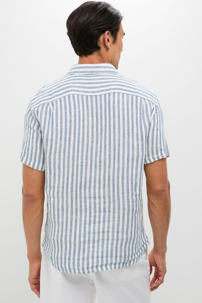 Back view of a man in an Ivory Stripe Short Sleeve Palma Linen Shirt, embodying classic and effortless style, perfect for a fun, high-end summer look.