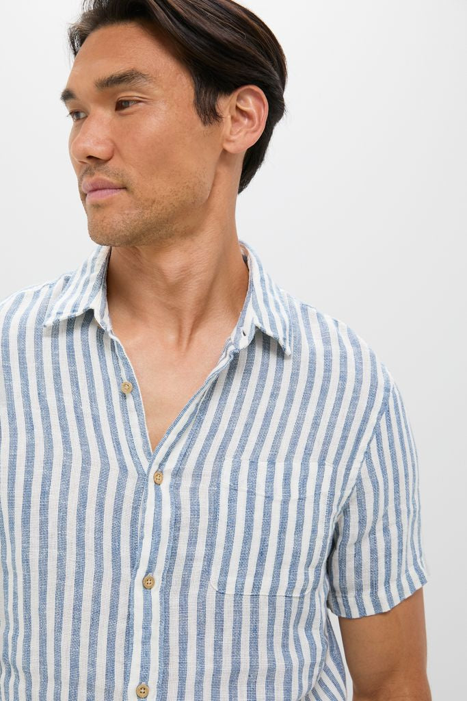 Man wearing classic Ivory Stripe Short Sleeve Palma Linen Shirt with vertical stripes; features include a front button placket and chest pocket for an effortless, high-end summer style.