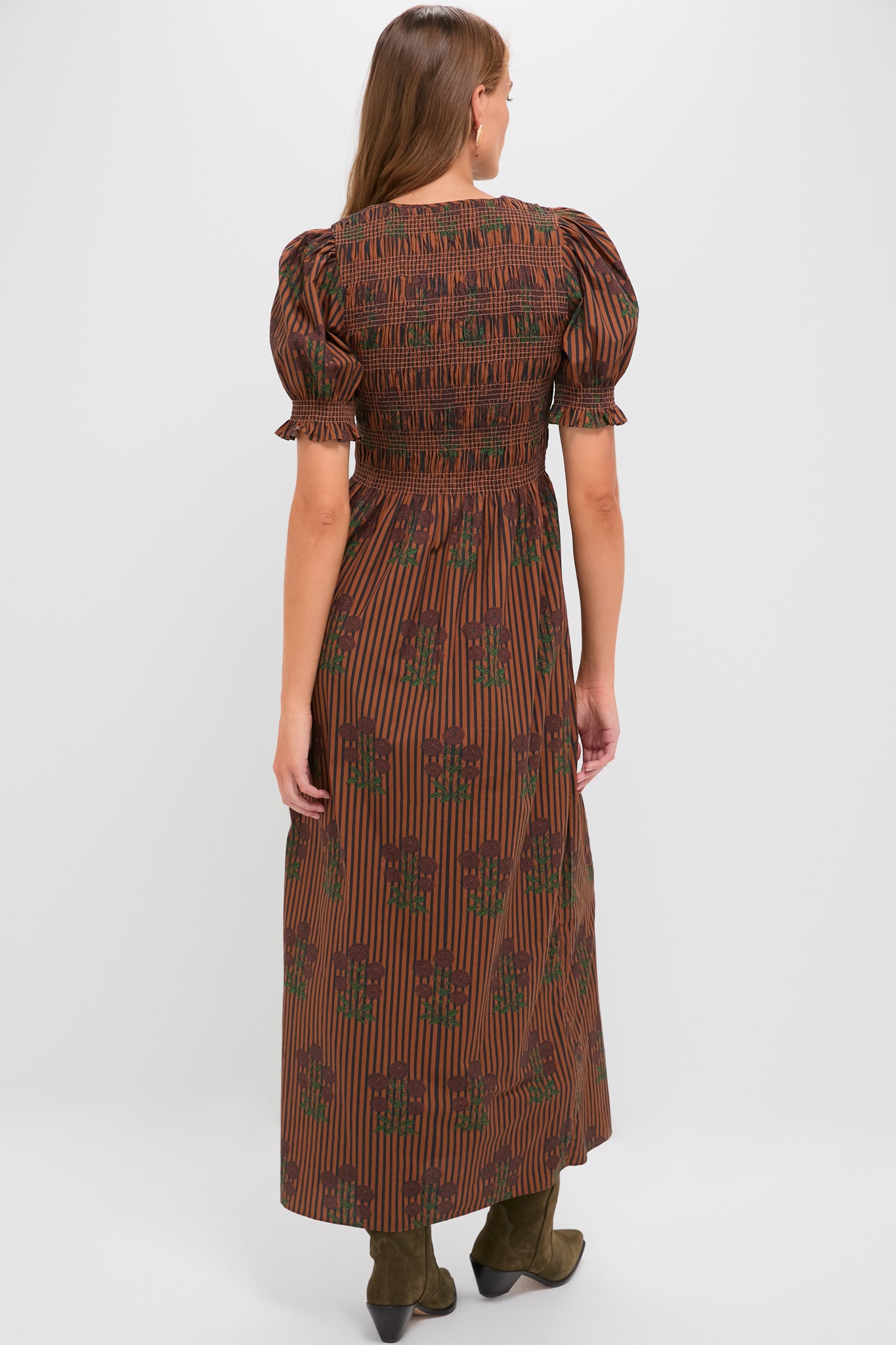 Multi Maribel Maxi Dress: Classic elegance with an effortless silhouette featuring puffed sleeves, smocked bodice, and playful stripes, styled with chic olive-green suede boots.