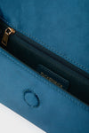 Peacock Blue Satin Gabrielle Clutch with braided tassel, gold zipper, and magnetic closure, offering a classic, effortless accessory for high-end, fun occasions.