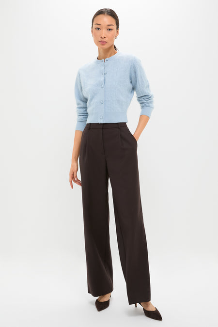 Model wearing the Light Blue Brushed Merino Wool Macy Cardigan, featuring a classic cropped design, paired effortlessly with high-waisted trousers and heels for a high-end, fun look.
