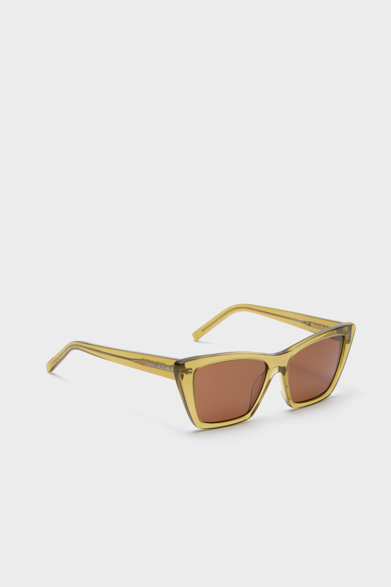 Shiny Transparent Ocra Mica Sunglasses: Classic cat-eye style with translucent yellow frame and amber lenses, embodying effortless, high-end fashion for fun and confident wear.