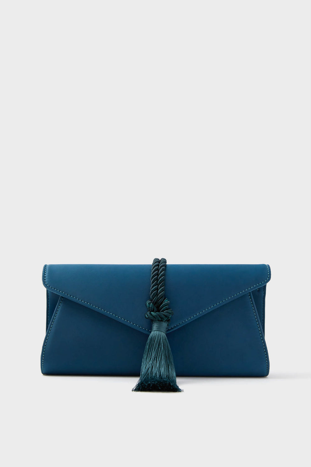 A blue envelope-style party clutch with a tassel and rope detail on the front, the Tuckernuck Accessories Satin Gabrielle Clutch is an elegant choice for special events.