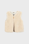 A sleeveless, cream-colored teddy vest by Bonton with a single front button and white lining adorned with small black stars—an ideal way to add Parisian chic to children’s outfits.
