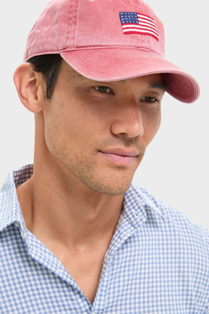 Man wearing Nantucket Red American Flag Needlepoint Hat, showcasing classic, high-end style with hand-stitched detail, perfectly embodying effortless and fun Americana fashion.