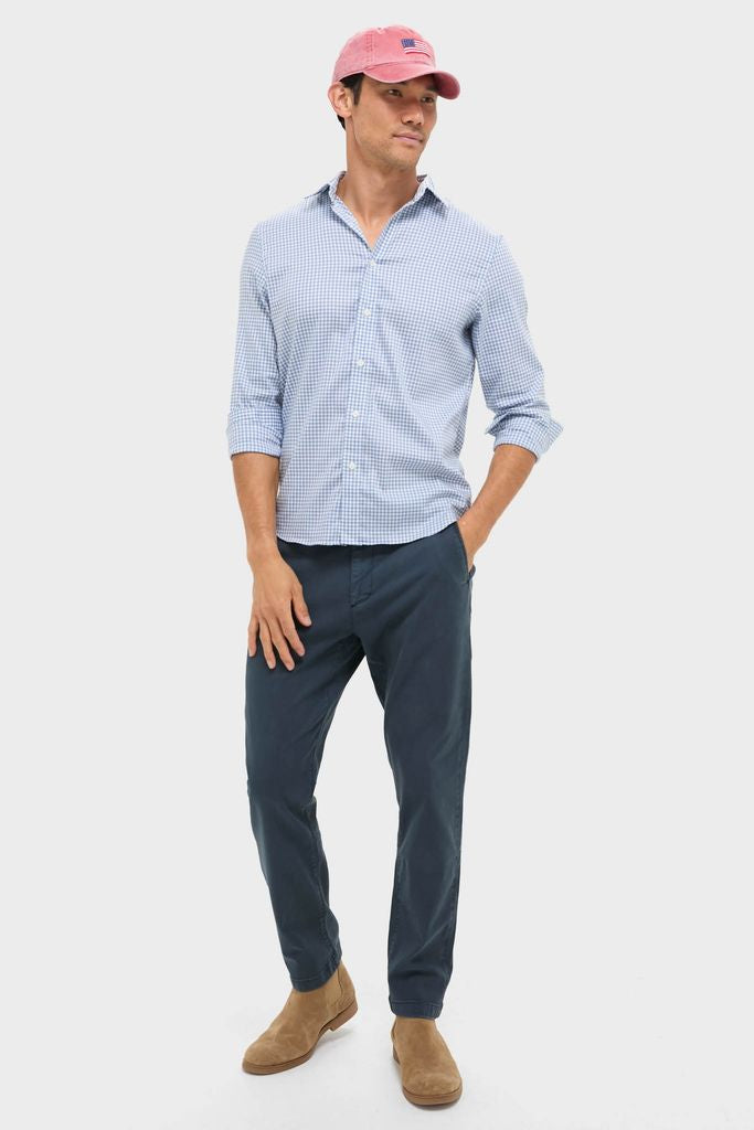 Model wearing Nantucket Red American Flag Needlepoint Hat, exuding classic and effortless style with fun Americana flair, paired with high-end casual attire.