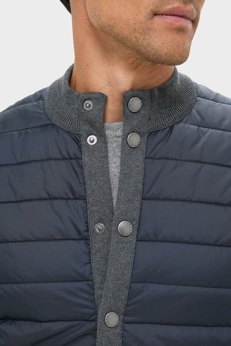 Mid Gray Essential Gilet showcasing classic, effortless style with a quilted front and heather-gray knit collar, perfect for high-end, fun layering in cool weather.