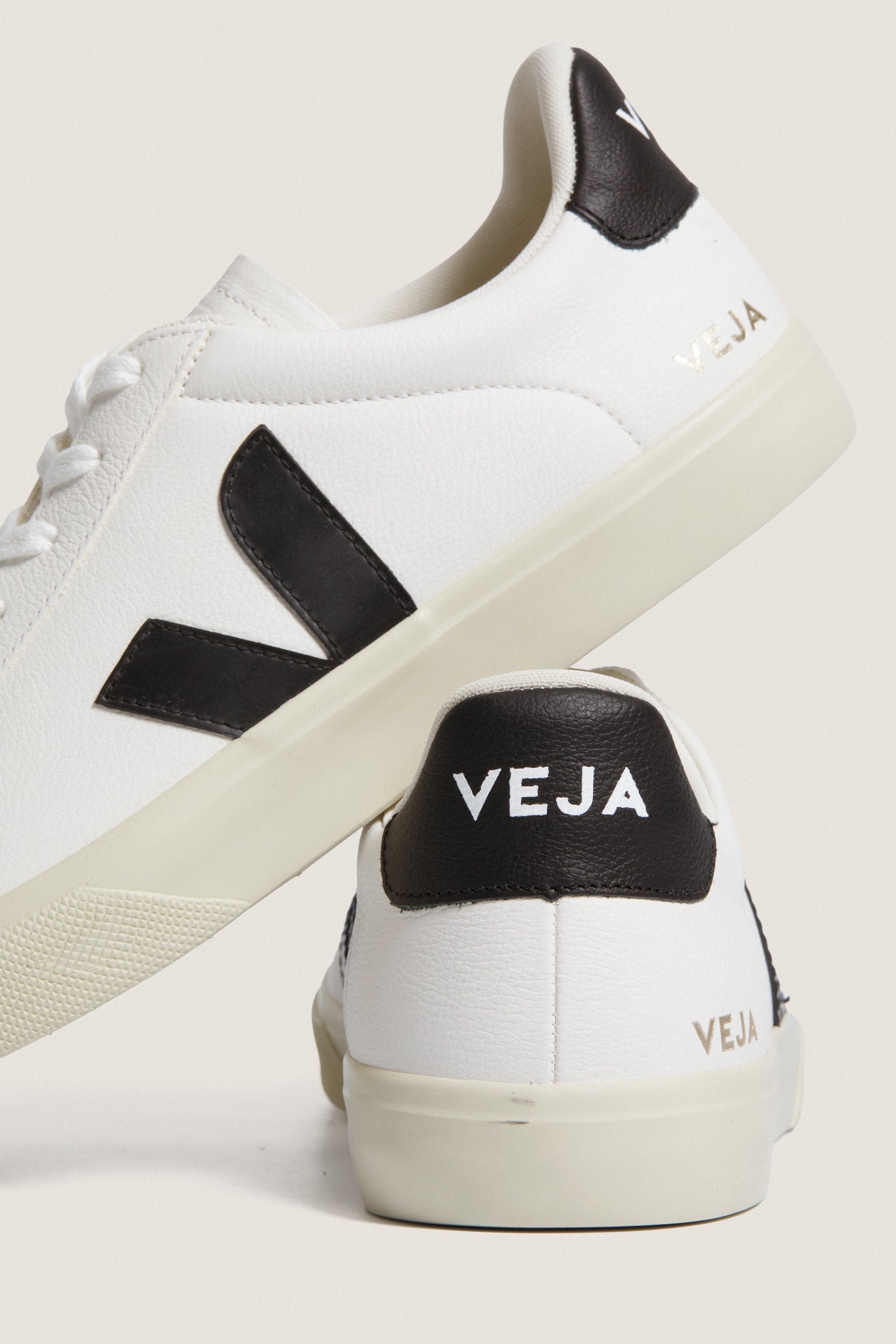 Men's Extra White Black Campo Sneakers by VEJA, showcasing a classic, effortless design with a white leather upper, black accents, and sustainable materials for high-end, fun style.