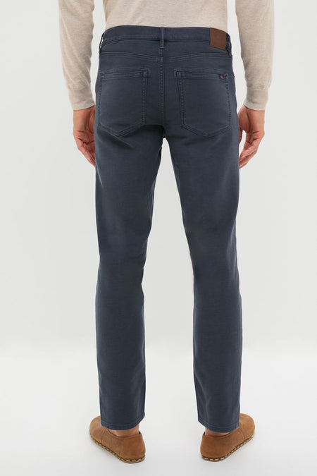 Navy Stretch Terry 5 Pocket trousers exemplify effortless style with classic straight-leg fit, back patch pockets, and a high-end leather brand patch, creating a fun, versatile look.