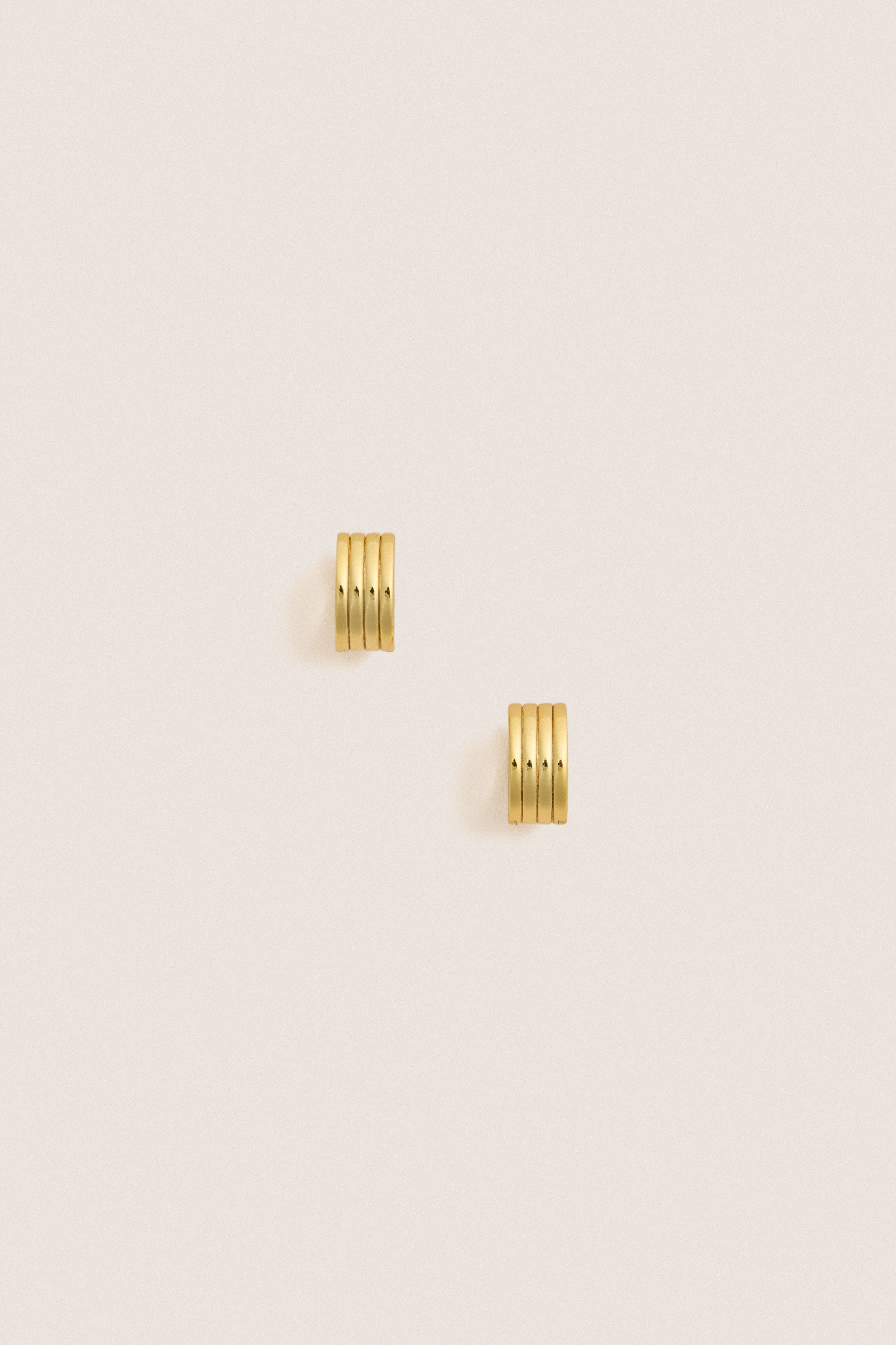 Gold Infinity Huggie Earrings
