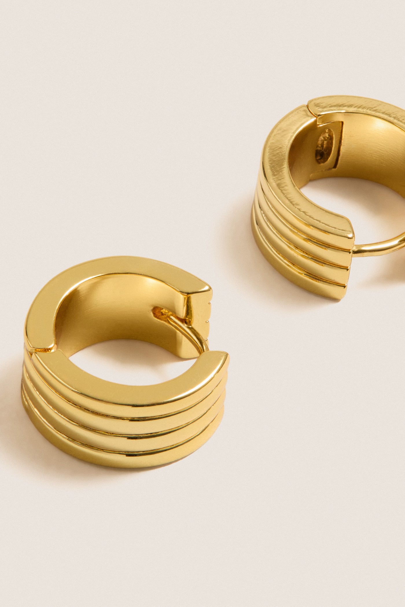 Gold Infinity Huggie Earrings