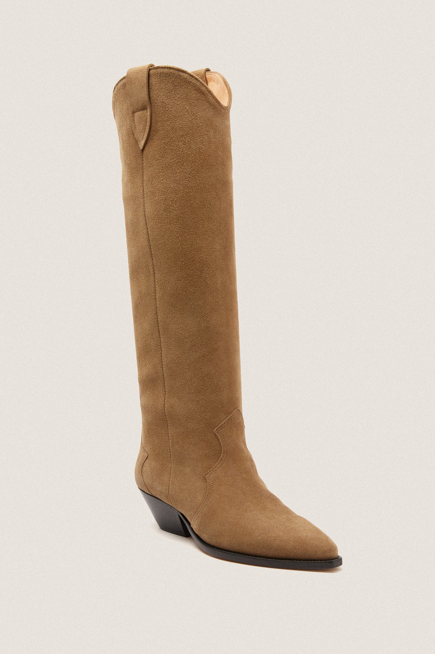 Taupe Denvee Boot: A classic, knee-high suede boot with a pointed toe, western stitching, and chunky heel—effortlessly blending high-end style with fun versatility.
