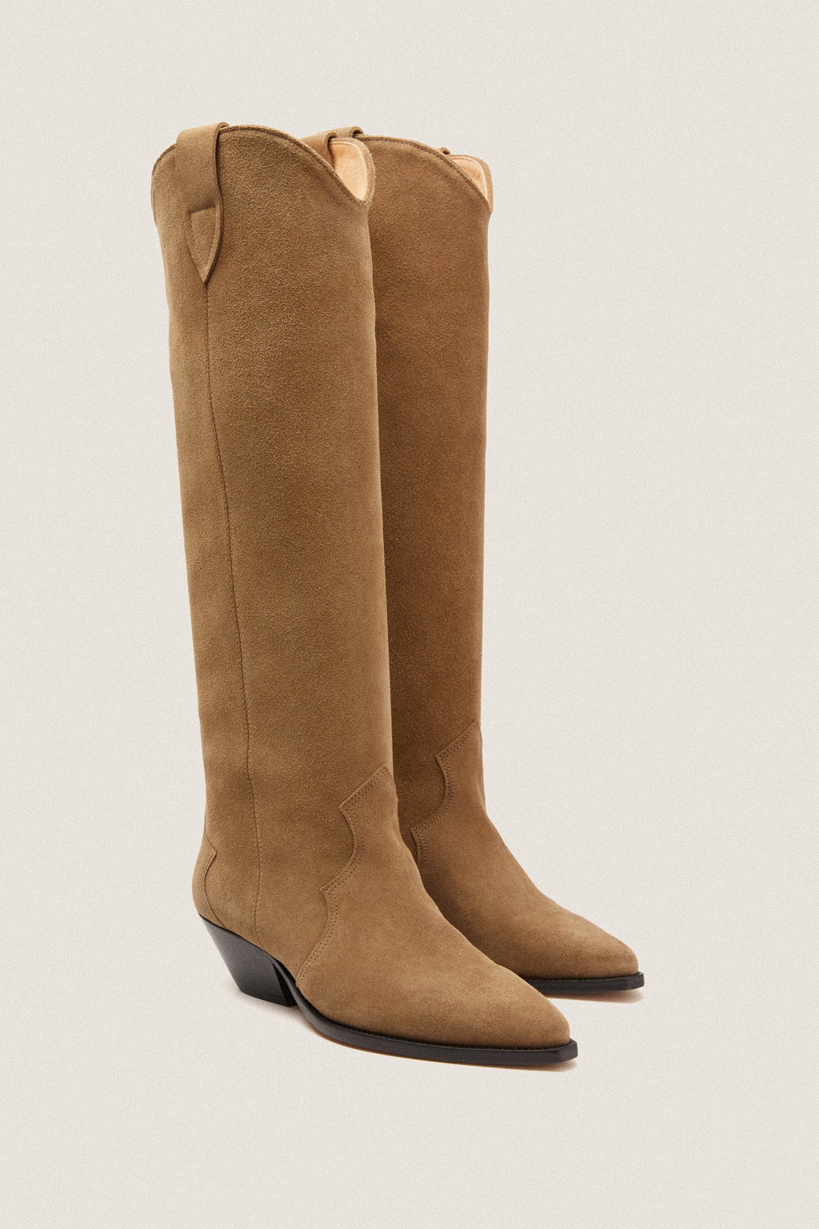 Taupe Denvee Boot in tan-brown suede, classic Western style with pointed toes and low wedge heels, effortlessly blending fun and high-end fashion for versatile wear.
