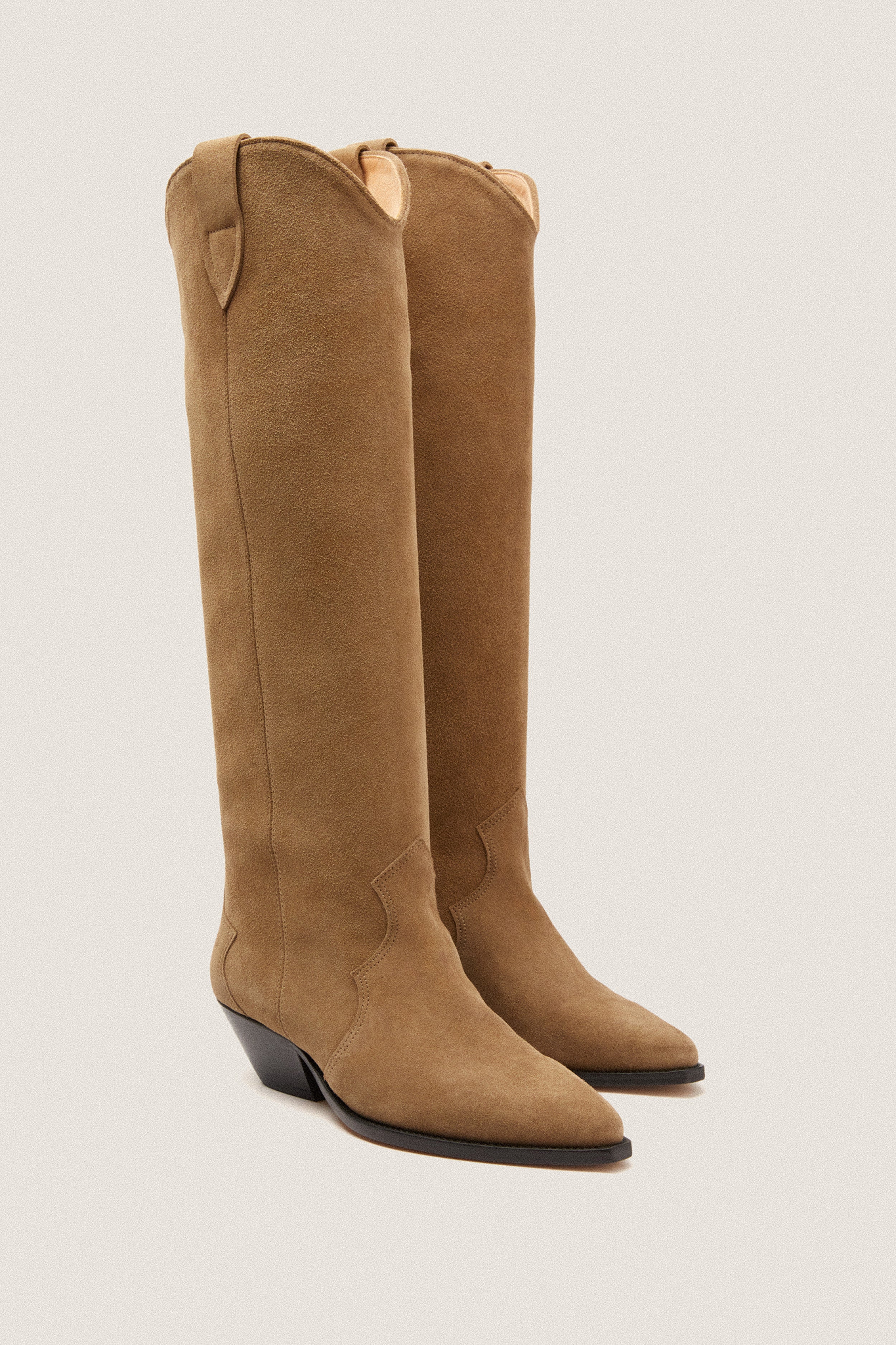 Taupe Denvee Boot in tan-brown suede, classic Western style with pointed toes and low wedge heels, effortlessly blending fun and high-end fashion for versatile wear.