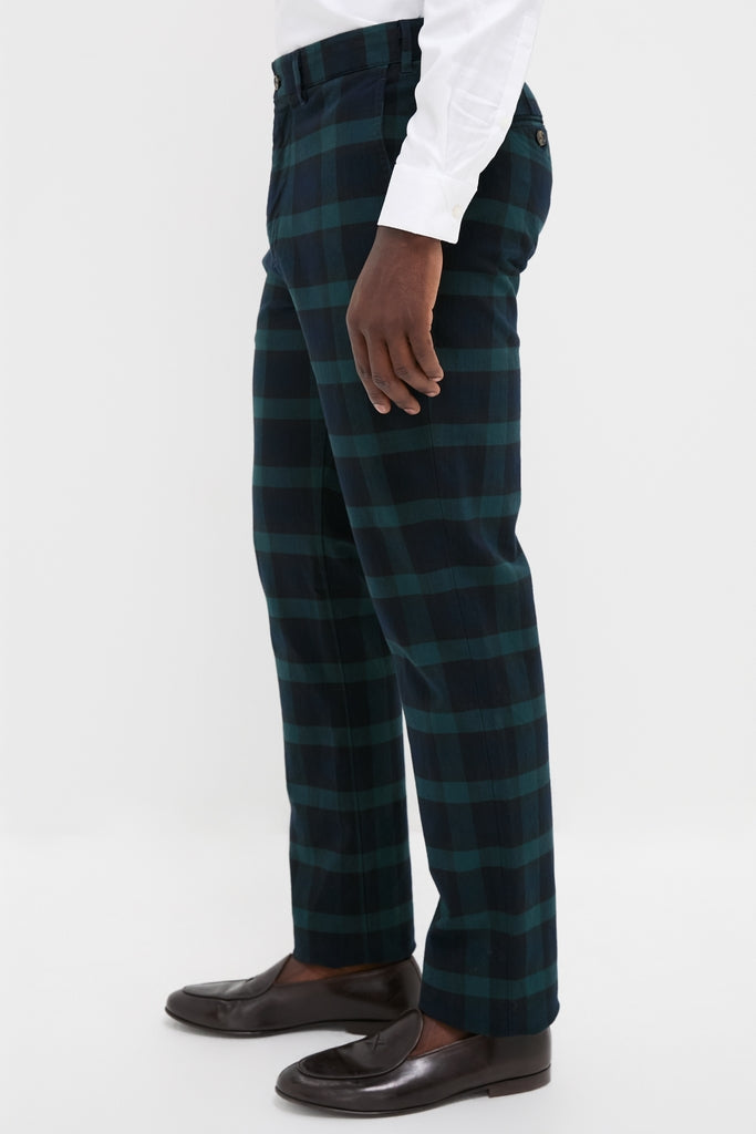 Blackwatch Tartan Stretch Twill Harbor Pants (34 Inseam) feature a classic, effortless design in a high-end tartan plaid, paired stylishly with dark brown loafers.