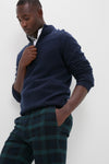Young man models Blackwatch Tartan Stretch Twill Harbor Pants, showcasing a classic, effortlessly stylish look with a modern twist, ideal for high-end, fun occasions.