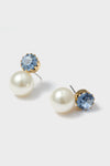 Sky Ines Earrings: Classic double-ended studs with a light-blue crystal and creamy faux pearl, offering effortless elegance for high-end occasions. Fun, versatile design for confident style.