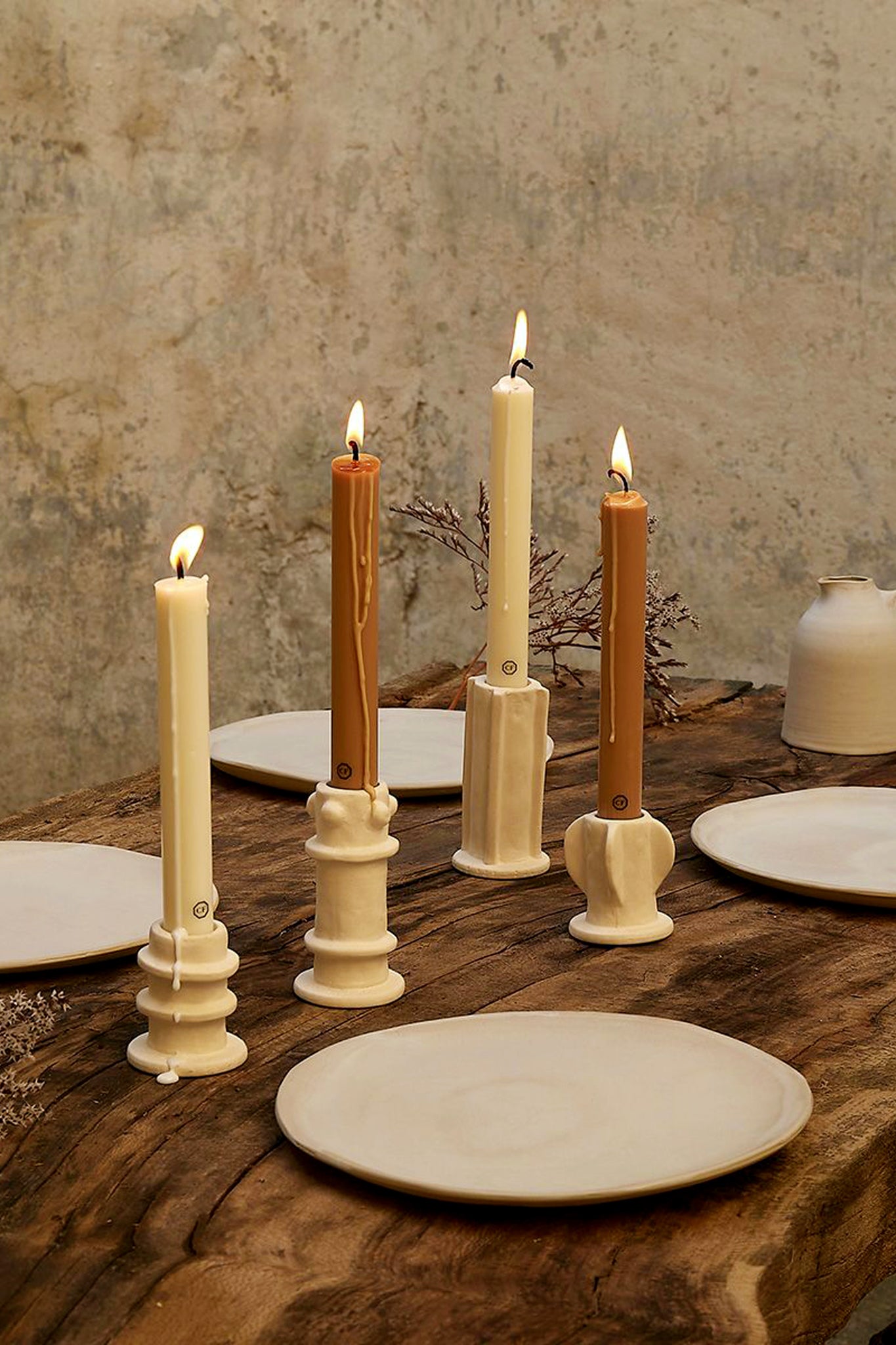 Cedar Scented Taper Candles add classic elegance to a rustic tablescape with effortless style, featuring sculptural ceramic holders and a high-end, handmade aesthetic.