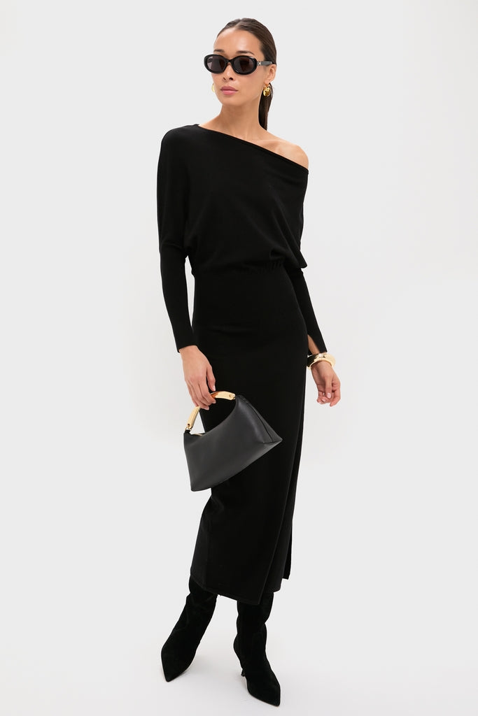 Model wearing classic, high-end Shiny Solid Black Marcie Sunglasses, effortlessly styled with an off-shoulder black ensemble, embodying fun, chic elegance and confidence.