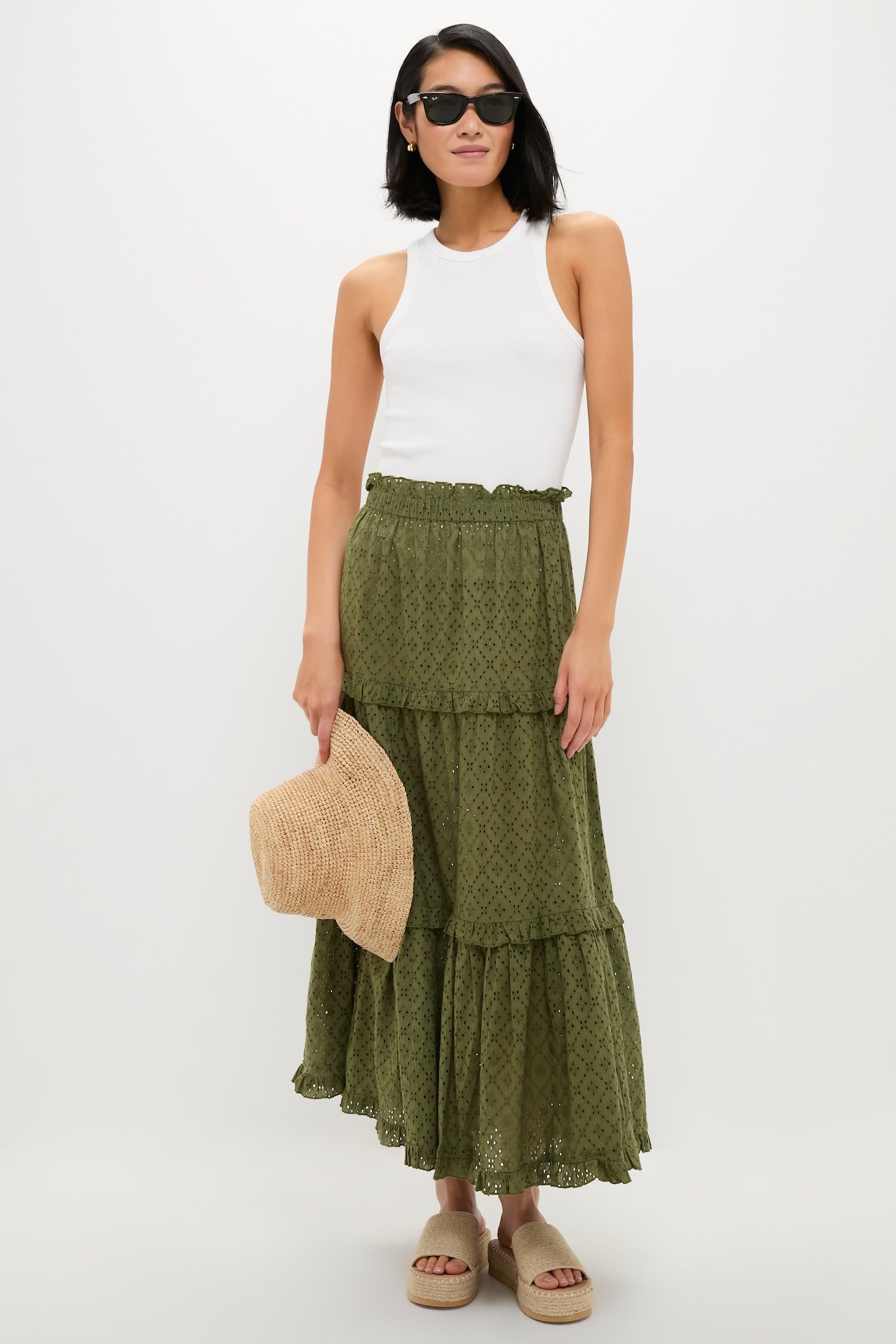 A stylish ensemble featuring Natural Del Mar Sandals with classic braided jute platform soles, effortlessly paired with a summery outfit for a fun, high-end look.