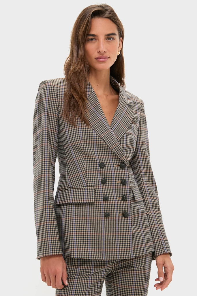 Woman models the Russet Multi Claude Dickey Jacket, a classic check-patterned, double-breasted blazer with matching slim-leg trousers, embodying effortless, high-end business-casual style.