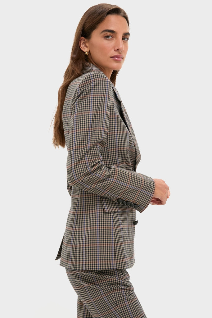 Woman in profile wearing the classic Russet Multi Claude Dickey Jacket, a tailored, effortless plaid suit in muted tones, epitomizing high-end, fun style.