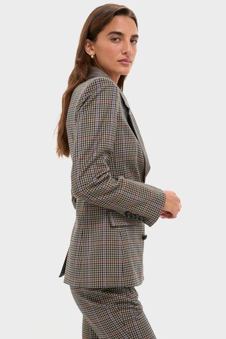 Woman in profile wearing the classic Russet Multi Claude Dickey Jacket, a tailored, effortless plaid suit in muted tones, epitomizing high-end, fun style.